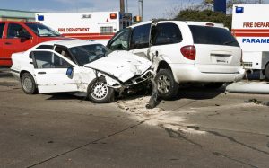 two white cars who got into a speeding accident